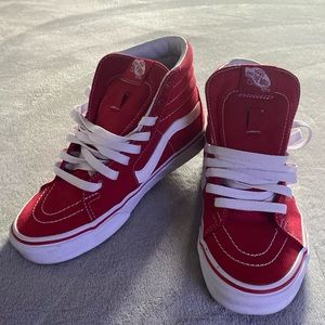 Women’s red and white high top Vans.